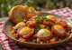 Caponata med kapers og rødvinseddike, serveret med frisk basilikum