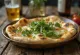 Naanbrød med gedeost og rucola serveret
