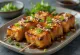 Atsuage tofu yakitori på spyd, serveret med sesam og forårsløg
